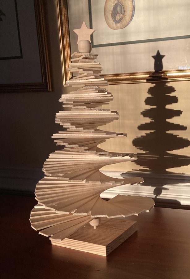 Handmade 12-inch wooden spiral tree with a star on top, given to the first 50 citizen sponsors