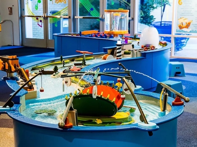 Water table indoors spouting water.